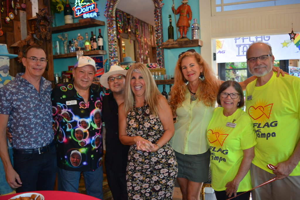 Community members together at a fundraiser supporting PFLAG Tampa